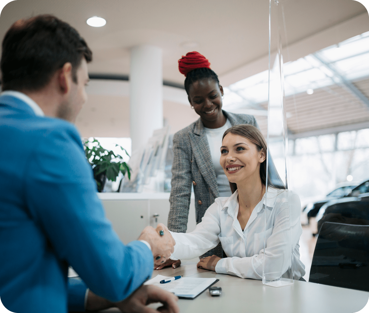 Business meeting handshake in modern office