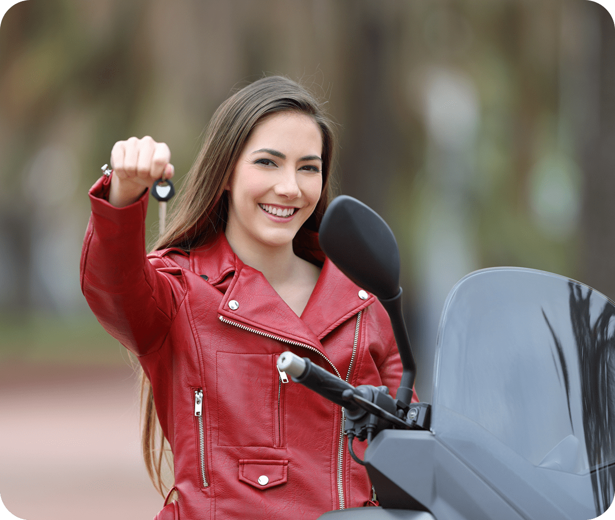 Smiling woman in red jacket with keys