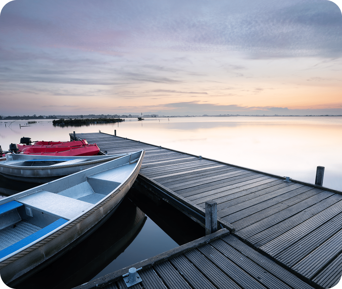 Boats by a tranquil lake dock