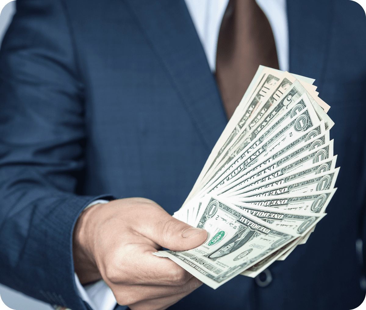 Handful of US currency being shown